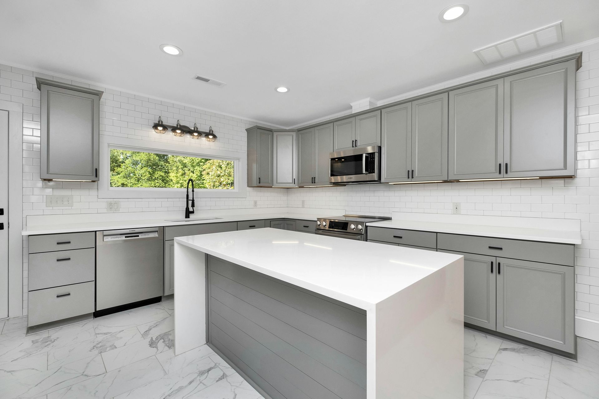 a kitchen with white cabinets